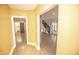 Hallway features a brick accent wall and wood floors at 615 E Morris St, Indianapolis, IN 46203