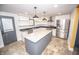 Modern kitchen with stainless steel appliances and a spacious center island at 615 E Morris St, Indianapolis, IN 46203