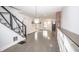 The stylish living room features hardwood floors, stairs, and an abundance of natural light at 615 E Morris St, Indianapolis, IN 46203