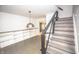 Cozy living room with stairs, built-in shelves, and hardwood floors at 615 E Morris St, Indianapolis, IN 46203