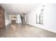 Spacious living room with hardwood floors, exposed brick, and ample natural light at 615 E Morris St, Indianapolis, IN 46203