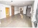 Bright living room features hardwood floors, built-in shelving, and access to the stairs at 615 E Morris St, Indianapolis, IN 46203