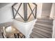 Modern staircase has gray wood treads and gray geometric banister at 615 E Morris St, Indianapolis, IN 46203