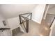 Modern staircase has gray wood treads and geometric banister at 615 E Morris St, Indianapolis, IN 46203