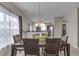Formal dining room with chandelier and an adjacent view of the kitchen at 6180 N Rosewood Dr, McCordsville, IN 46055