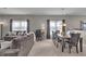 Open-concept living and dining area featuring comfortable seating and ample natural light at 6180 N Rosewood Dr, McCordsville, IN 46055
