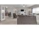 Spacious living room features a fireplace, ceiling fan and an open doorway to the office at 6180 N Rosewood Dr, McCordsville, IN 46055
