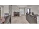 Open-concept living and dining area with staircase to the second floor at 6180 N Rosewood Dr, McCordsville, IN 46055