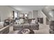 Open living area showcasing a sofa, office space and view of the kitchen at 6180 N Rosewood Dr, McCordsville, IN 46055