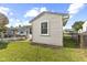 A cozy home with a neat backyard and clean white vinyl siding, showing off its curb appeal at 633 Fletcher Ln, Beech Grove, IN 46107