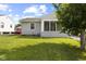 Well-maintained backyard with a lush green lawn and charming exterior features at 633 Fletcher Ln, Beech Grove, IN 46107