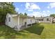 A spacious backyard featuring a covered patio and a view of the back of the house at 633 Fletcher Ln, Beech Grove, IN 46107