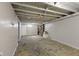 Unfinished basement with exposed joists and painted walls at 633 Fletcher Ln, Beech Grove, IN 46107