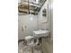 Simple basement bathroom with exposed piping and basic fixtures at 633 Fletcher Ln, Beech Grove, IN 46107