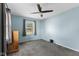 Neutral bedroom features carpet, window, and wooden dresser at 633 Fletcher Ln, Beech Grove, IN 46107