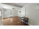 Open living space with hardwood floors flowing into the dining area and living room at 633 Fletcher Ln, Beech Grove, IN 46107
