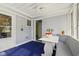 Sunroom features bench seating, table, and bright light at 633 Fletcher Ln, Beech Grove, IN 46107