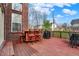 Back deck with outdoor furniture, grill, and brick exterior at 6545 Briarwood Pl, Zionsville, IN 46077