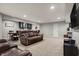 Finished basement with a wet bar, media center, and comfortable seating area at 6545 Briarwood Pl, Zionsville, IN 46077