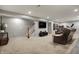 Finished basement features a staircase, flat screen TV, and cozy seating area at 6545 Briarwood Pl, Zionsville, IN 46077