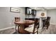 Basement bar area featuring a dining table and chairs for entertaining guests at 6545 Briarwood Pl, Zionsville, IN 46077