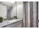 Bathroom featuring a vanity with granite countertop and a gray and yellow patterned shower curtain at 6545 Briarwood Pl, Zionsville, IN 46077