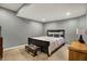 Well-lit bedroom with neutral carpet, gray walls, and furnishings at 6545 Briarwood Pl, Zionsville, IN 46077