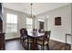 Elegant dining room features hardwood floors, a wooden dining set, and natural light at 6545 Briarwood Pl, Zionsville, IN 46077