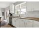 Bright kitchen with granite countertops, stainless steel appliances, white subway tile backsplash, and wooden floors at 6545 Briarwood Pl, Zionsville, IN 46077