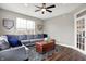 Cozy living room with a gray sectional sofa and a decorative wooden chest, perfect for relaxation at 6545 Briarwood Pl, Zionsville, IN 46077