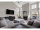 Open living room showcases vaulted ceilings, a fireplace, and comfortable gray seating at 6545 Briarwood Pl, Zionsville, IN 46077