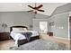 Spacious main bedroom featuring a ceiling fan and neutral decor at 6545 Briarwood Pl, Zionsville, IN 46077