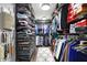 Spacious walk-in closet with custom shelving and ample storage space for clothes and shoes at 6545 Briarwood Pl, Zionsville, IN 46077
