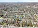 Areal view of quiet neighborhood with tree-lined streets and skyline in the distance at 741 Dequincy St, Indianapolis, IN 46201