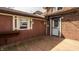 Cozy back porch with wood flooring and access to the home at 741 Dequincy St, Indianapolis, IN 46201