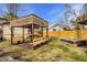Backyard showing bench area with table, built in benches and lawn at 741 Dequincy St, Indianapolis, IN 46201