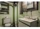 Outdated unfinished bathroom with white painted brick and small basin sink at 741 Dequincy St, Indianapolis, IN 46201