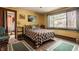 Comfortable bedroom with hardwood floors, natural light, and neutral decor for a peaceful retreat at 741 Dequincy St, Indianapolis, IN 46201