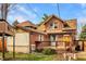 Exterior view of a two-story brick home with a deck and well-maintained landscaping at 741 Dequincy St, Indianapolis, IN 46201