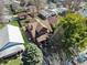 Exterior of brick home featuring mature trees and landscaping in a well-established neighborhood at 741 Dequincy St, Indianapolis, IN 46201