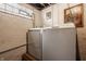 Bright basement laundry area featuring modern washer and dryer units at 741 Dequincy St, Indianapolis, IN 46201