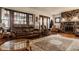 Spacious living room with hardwood floors, stone fireplace, and comfortable seating at 741 Dequincy St, Indianapolis, IN 46201