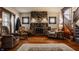 Cozy living room featuring a stone fireplace, hardwood floors, and classic decor at 741 Dequincy St, Indianapolis, IN 46201