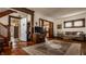 Inviting living room featuring hardwood floors, elegant rug, and traditional-style architectural details at 741 Dequincy St, Indianapolis, IN 46201