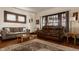 Bright living room showcasing hardwood floors, natural light, and comfortable furniture at 741 Dequincy St, Indianapolis, IN 46201