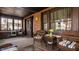 Relaxing sunroom featuring wicker chairs, tables, and charming decor, perfect for lounging at 741 Dequincy St, Indianapolis, IN 46201
