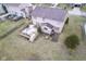 Backyard aerial showing a spacious deck, a pool, and a home with light exterior at 7531 Bancaster Dr, Indianapolis, IN 46268