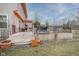 Exterior view of the backyard featuring a spacious deck and manicured lawn at 7531 Bancaster Dr, Indianapolis, IN 46268