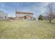 View of the expansive backyard showing deck and the layout of the home at 7531 Bancaster Dr, Indianapolis, IN 46268