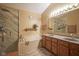 Bright bathroom with marble walk-in shower, soaking tub, and double sink vanity with granite countertop at 7531 Bancaster Dr, Indianapolis, IN 46268